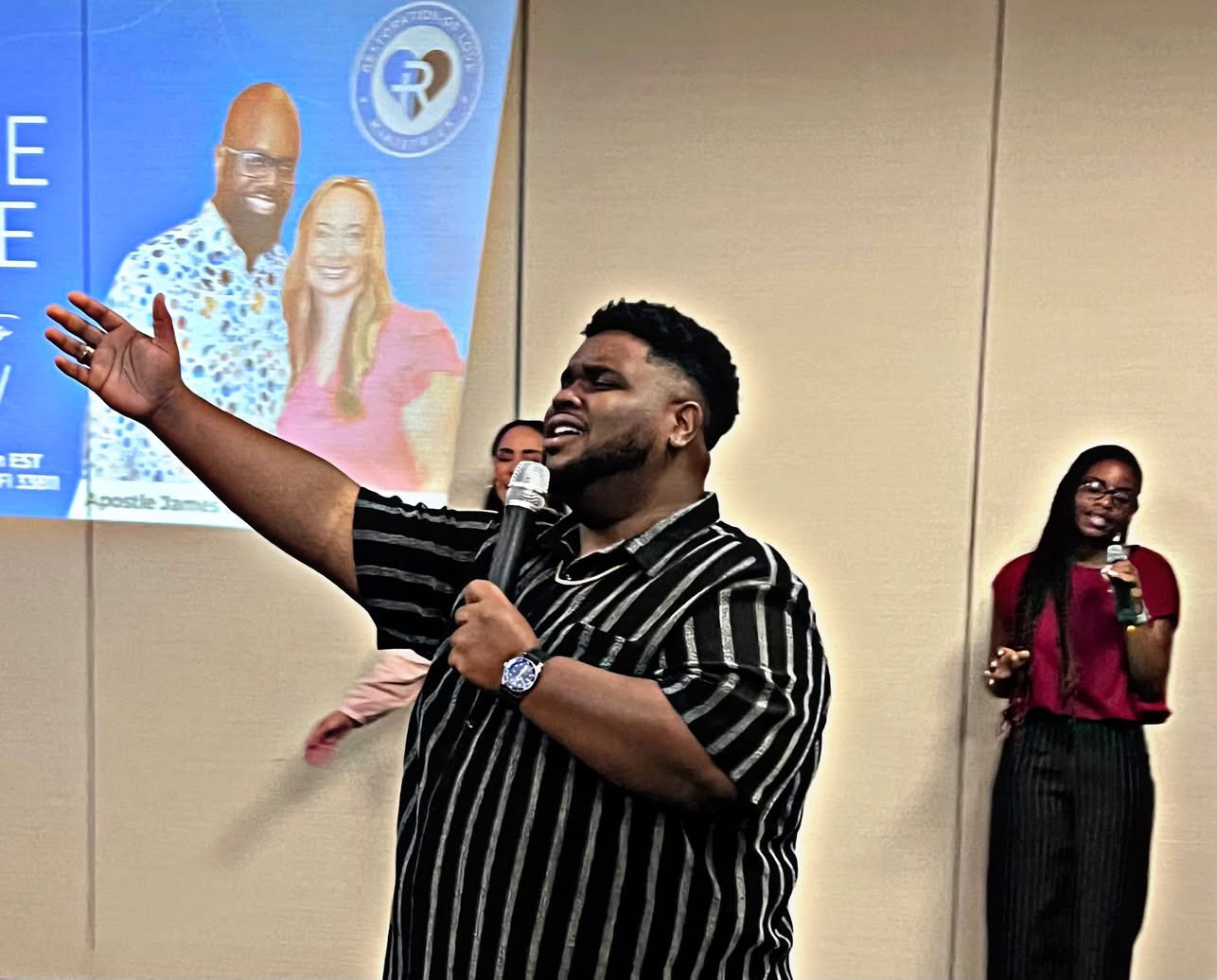 A preacher in deep blue stage light
